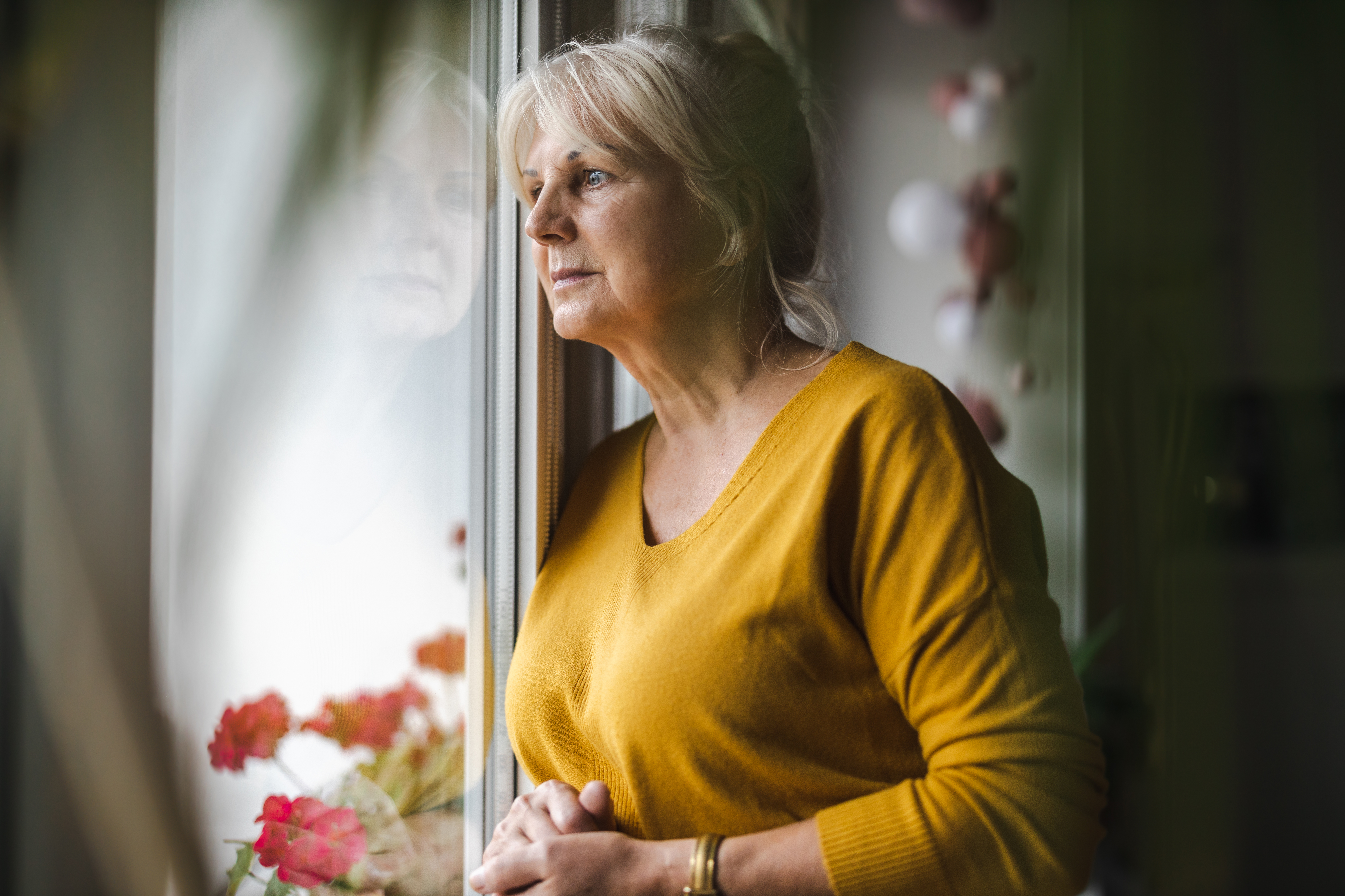 woman_lookingout_of_the_women_looking_wistful