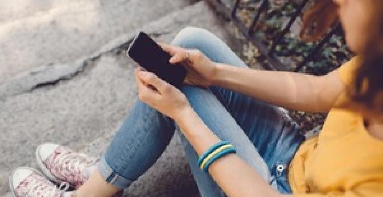 young_woman_looking_at_her_phone