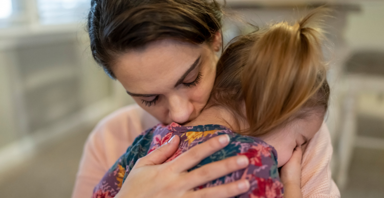 dark_haired_woman_hugging_a_small_child