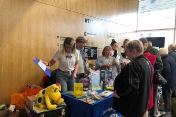 people gathered at an information event