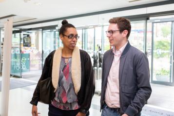 young_white_man_and_young_black_woman_talking