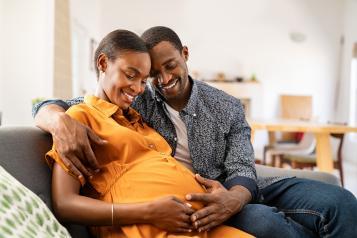 black_man_and_black_pregnant_woman_embracing