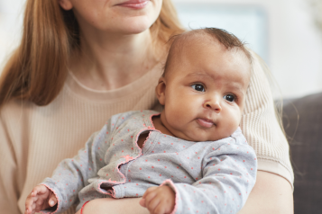 Baby_being_held_by_a_woman