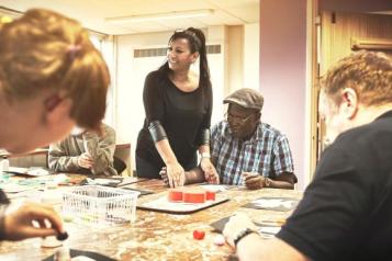 people_sitting_at_a_table_playing_bingo