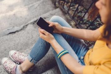 young_woman_looking_at_her_phone