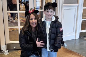 mum_crounching_down_with_her_young_son_standing_by_her_side