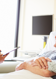 Man_and_woman_talking_to_a_doctor_in_hospital